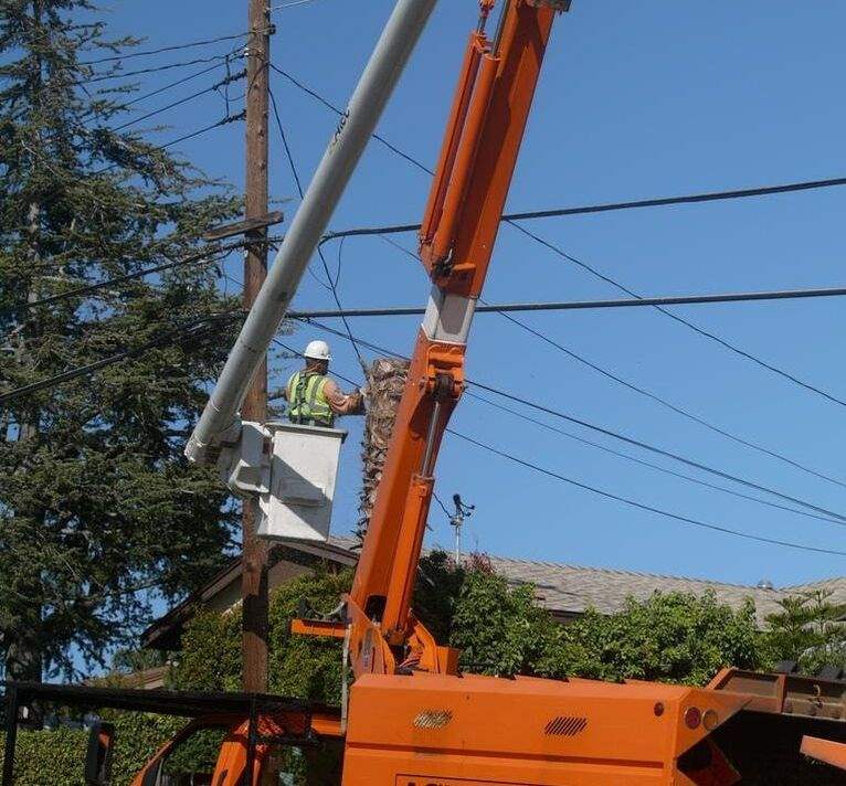 crane-clearing-limbs-from-power-lines.jpg