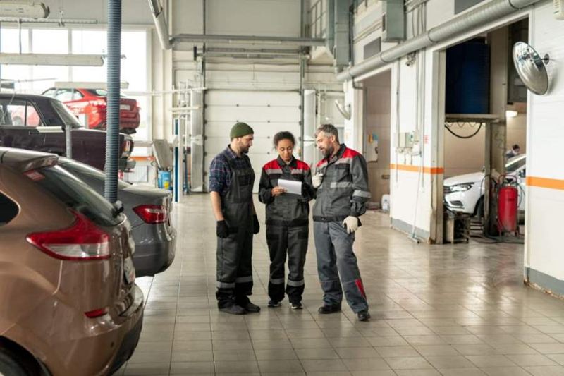 three-intercultural-workers-of-car-maintenance-cen-CEG7UUU-scaled.jpg