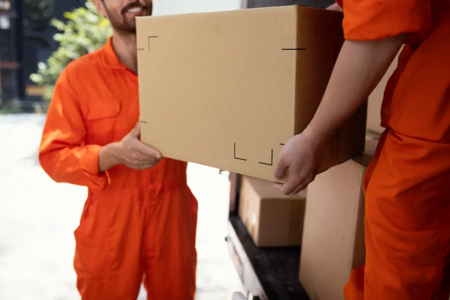 close-up-young-delivery-men-moving-objects-out-car_23-2148944589.jpg