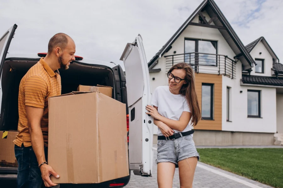 young-family-moving-into-their-new-house_1303-23769.jpg