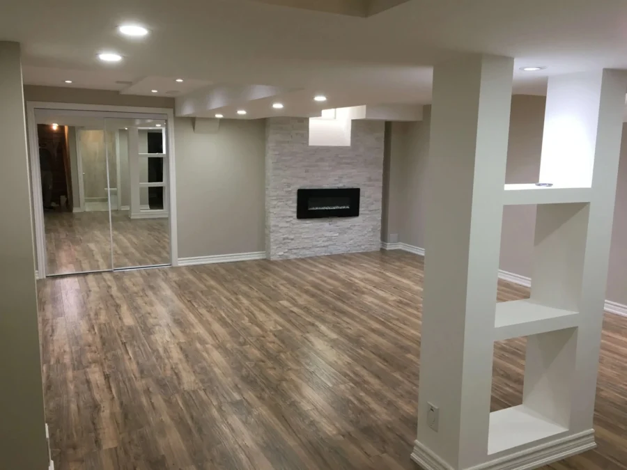 basement-renovation-gta-modern-fireplace-open-layout.jpg